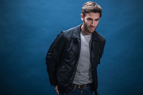 Blue, Facial hair, Jacket, Leather, Leather jacket, Beard, Hairstyle, Standing, Cool, Cheek, 