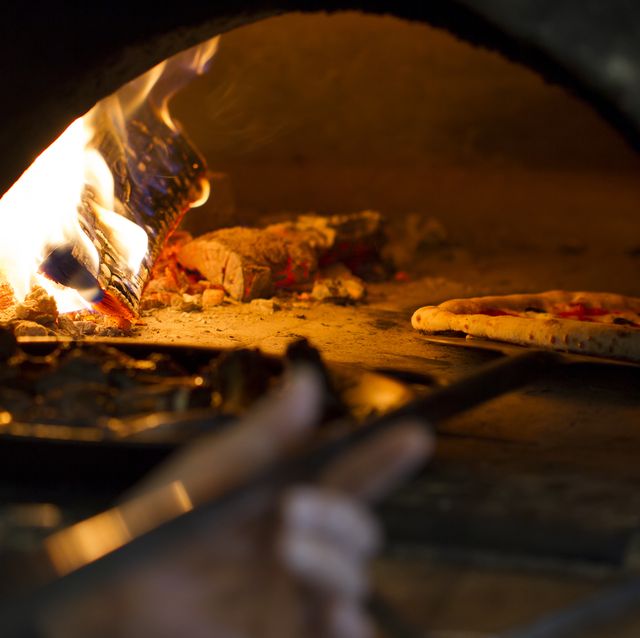 pizza baking in wood oven