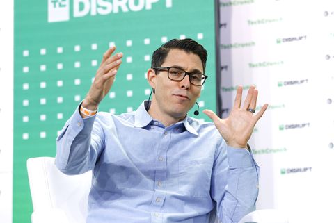 rj scaringe speaking at tech disrupt and gesturing