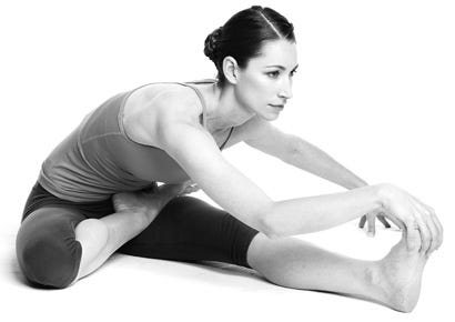 forward bend with rolled up blanket yoga pose