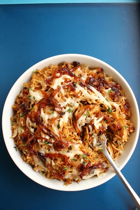 white bowl of french onion rice on a blue background