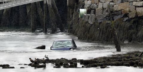 Car in water off pier in restricted zone at end of India Street. car in water off pier in restricted zone at end of india street