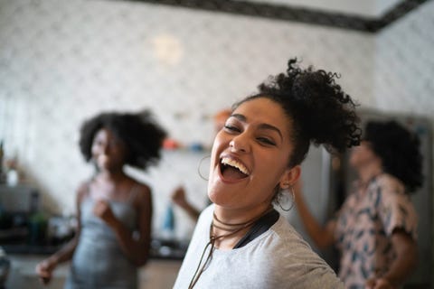 friends dancing and having fun at kitchen