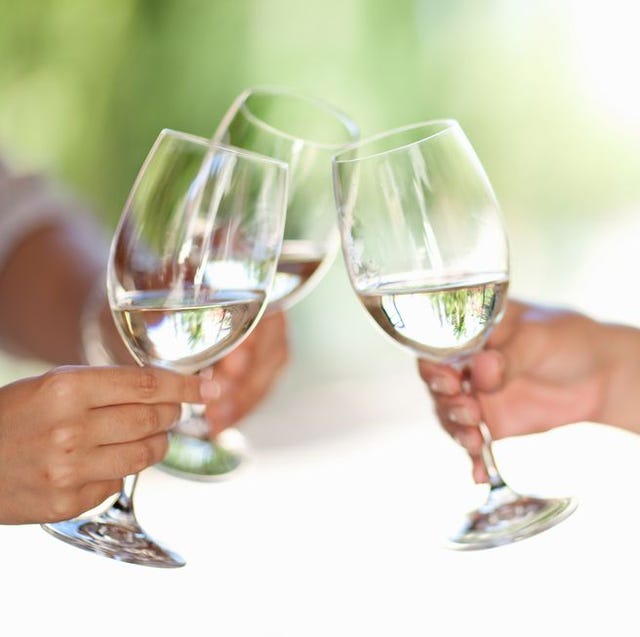 Friends toasting with wine outdoors Friends toasting with wine outdoors
