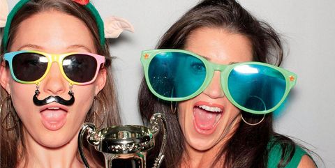 Caroline Kaczor and Rebecca Alexander party photobooth with fun props, glasses