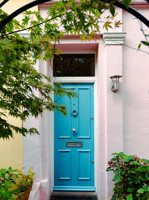 front door paint, exterior architecture of terraced residential houses in the area of notting hill, an affluent area of london, uk