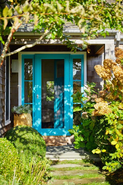 front porch with blue door frame