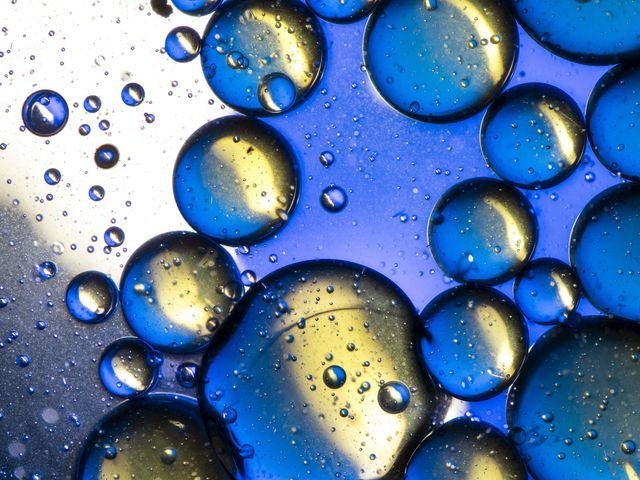 full frame contaminated water with bubbles of oil