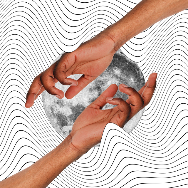 two hands reach out over a full moon
