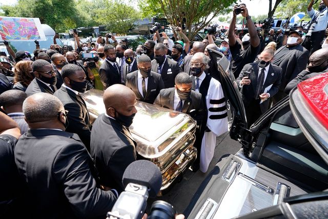 pallbearers move the casket of george floyd into a hearse as the rev al sharpton c looks on following floyd's funeral june 9, 2020, at the fountain of praise church in houston   george floyd will be laid to rest tuesday in his houston hometown, the culmination of a long farewell to the 46 year old african american whose death in custody ignited global protests against police brutality and racism thousands of well wishers filed past floyd's coffin in a public viewing a day earlier, as a court set bail at 1 million for the white officer charged with his murder last month in minneapolis photo by david j phillip  pool  afp photo by david j phillippoolafp via getty images