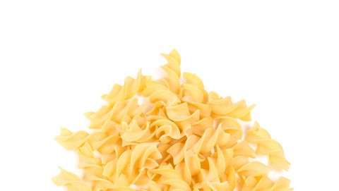 fusilli dry pasta isolated on white background