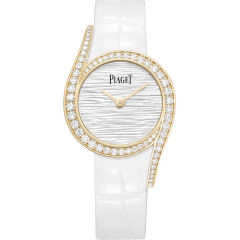 piaget's newest watch for ladies can be expressed in three words radiant, spirited and seductive it takes the linearity out of time, placing it instead on a curve of pure femininity its round 26 mm case is enhanced by two elegant elongated lugs and the voluptuousness of its curves is highlighted on the bezel by a line of graduated round diamonds the pure appearance of its dial results in a very contemporary, yet classic allure, with its white mother of pearl engraved "palace decor" and its white alligator strap