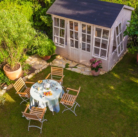 garden shed and laid table in garden