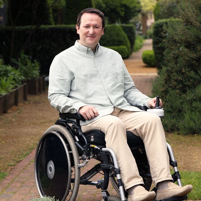 landscape designer and gardeners' world presenter mark lane in a wheelchair in the geffrye museum garden