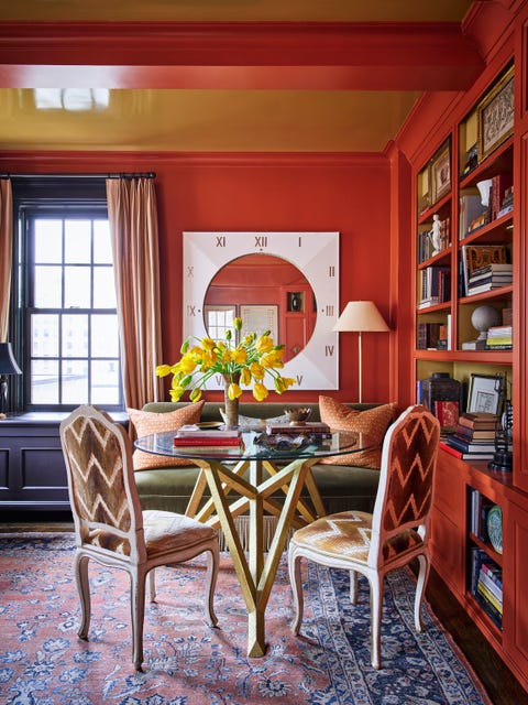 the plentiful south and east facing light of this former bedroom inspired him to turn it into his study and cloak it in seductive red