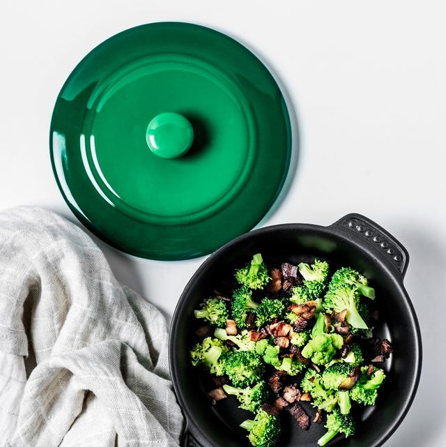 Broccoli salad with fried bacon a bowl of broccoli salad with fried bacon on white background
