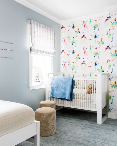 gender neutral nurseries with fun colorful wallpaper and white crib