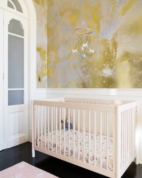 contemporary nursery with metallic wallpaper