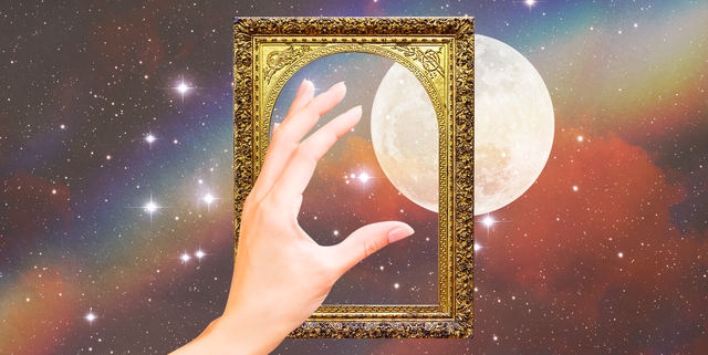 a hand reaches through a golden picture frame towards a full moon in a rainbow sky