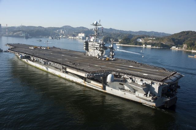 pacific ocean, november 20, 2012   the aircraft carrier uss george washington transits tokyo bay to its forward operating location of yokosuka, japan