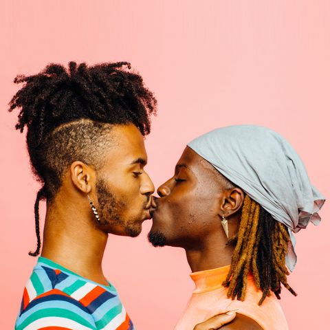 gay black couple kissing - groups at risk for HIV