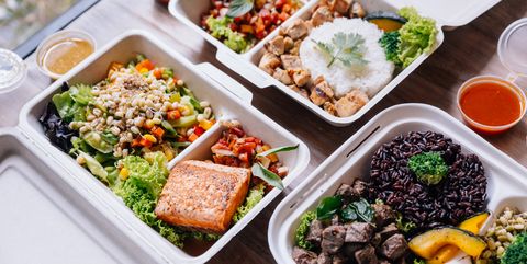 clean food meal boxes rice and rice berry with beef salmon and chicken in various vegetables and salad for good health