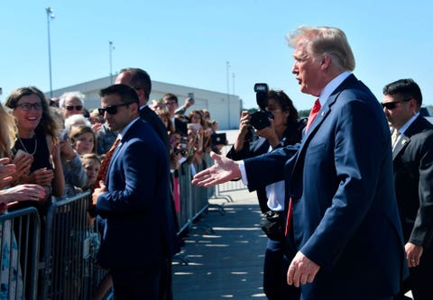 US-POLITICS-TRUMP-FUNDRAISING us president trump walks to greet supporters after landing at sioux falls regional airport to attend a fundraiser in sioux falls, south dakota on september 7, 2018 photo by nicholas kamm afp photo credit should read nicholas