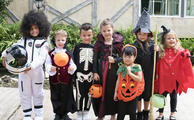 diverse kids in halloween costumes