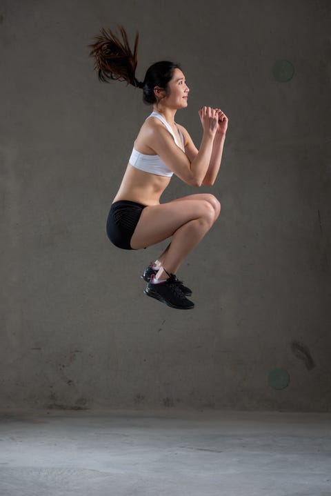 A young asian woman is doing stretching training