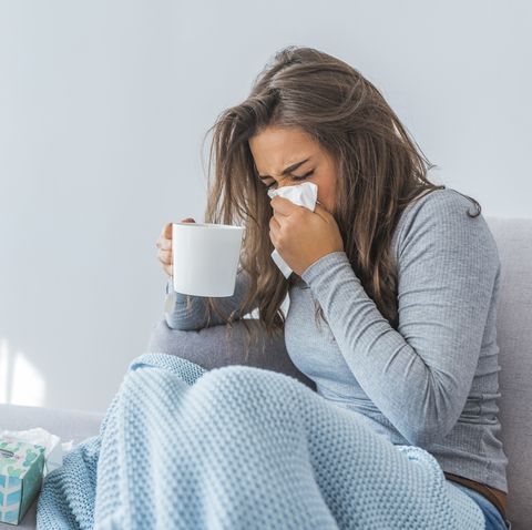 Woman resting with cold & flu symptoms 