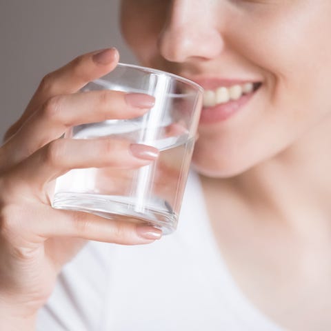 Close up of thirsty woman enjoying pure water close up of smiling woman feeling thirsty enjoying pure mineral water, dehydrated young female holding glass drinking aqua, girl taking care of own health concept of healthy lifestyle, good habit
