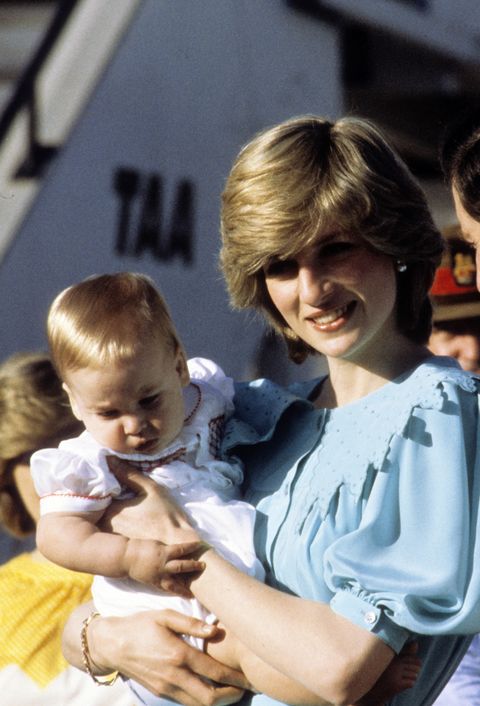 alice springs, australia   march 20 diana, princess of wales, wearing a turquoise silk calf length button down dress with a large frill collar designed by jan van velden and carrying baby prince william, arrives at alice springs airport at the start of their tour of australia on march 20, 1983 in alice springs, australia photo by anwar husseingetty images