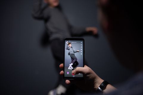 an afp collaborator poses for a picture using the smart phone application tiktok on december 14, 2018 in paris   tiktok, is a chinese short form video sharing app, which has proved wildly popular this year photo by    afp        photo credit should read  afp via getty images
