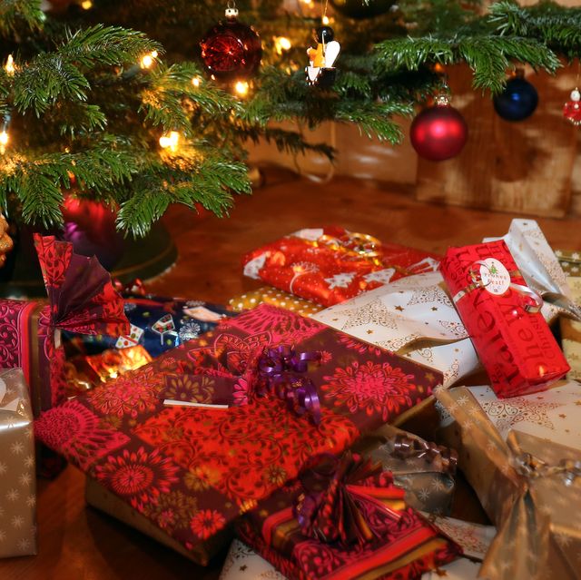24 december 2018, bavaria, kaufbeuren packed christmas presents lie under a christmas tree photo karl josef hildenbranddpa photo by karl josef hildenbrandpicture alliance via getty images