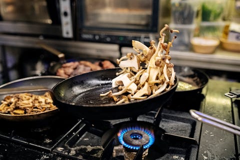 Pan frying mushrooms.