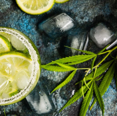 Lime cocktails with marijuana on stone table lime cocktails with marijuana on stone table top view