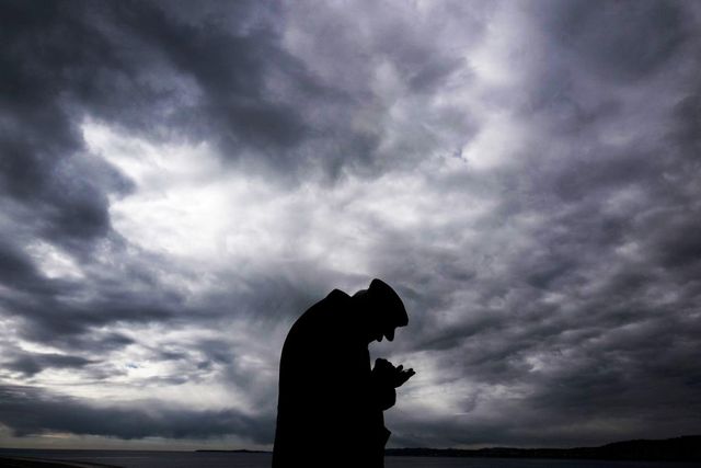 an elderly man looks at his smartphone as he stands at the mediterranean sea near the promenade des anglais in the french riviera city of nice on february 3, 2019 photo by valery hache  afp        photo credit should read valery hacheafp via getty images