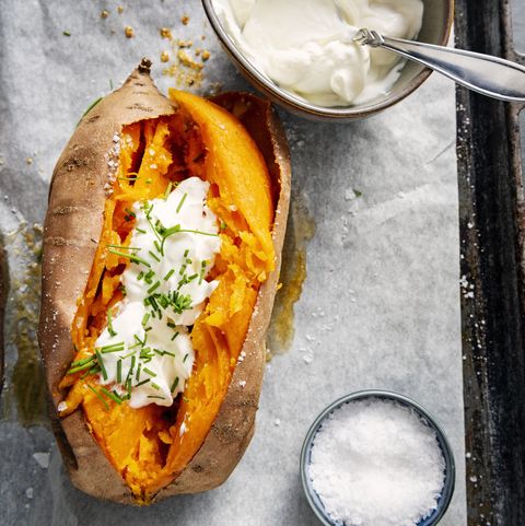 Baked sweet potato with sour cream, chives.