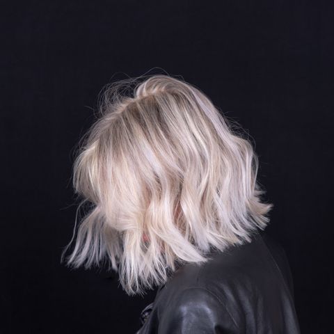 woman with platinum blunt shoulder length bob hairstyle