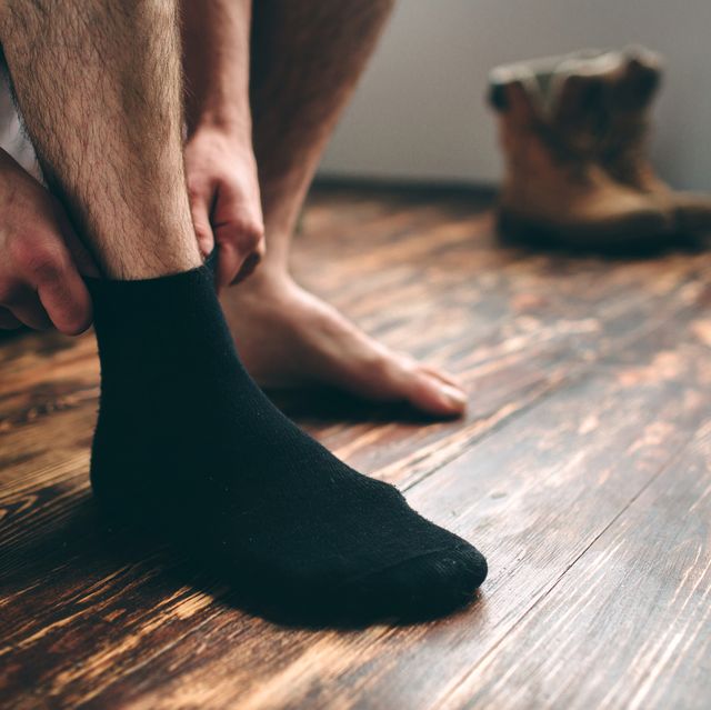 the man wears black socks mens style