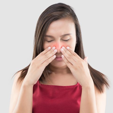  Woman Suffering From blocked nose