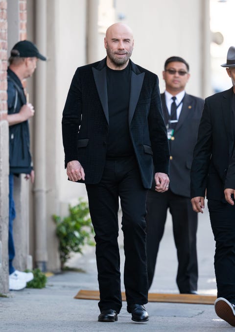 why is john travolta bald