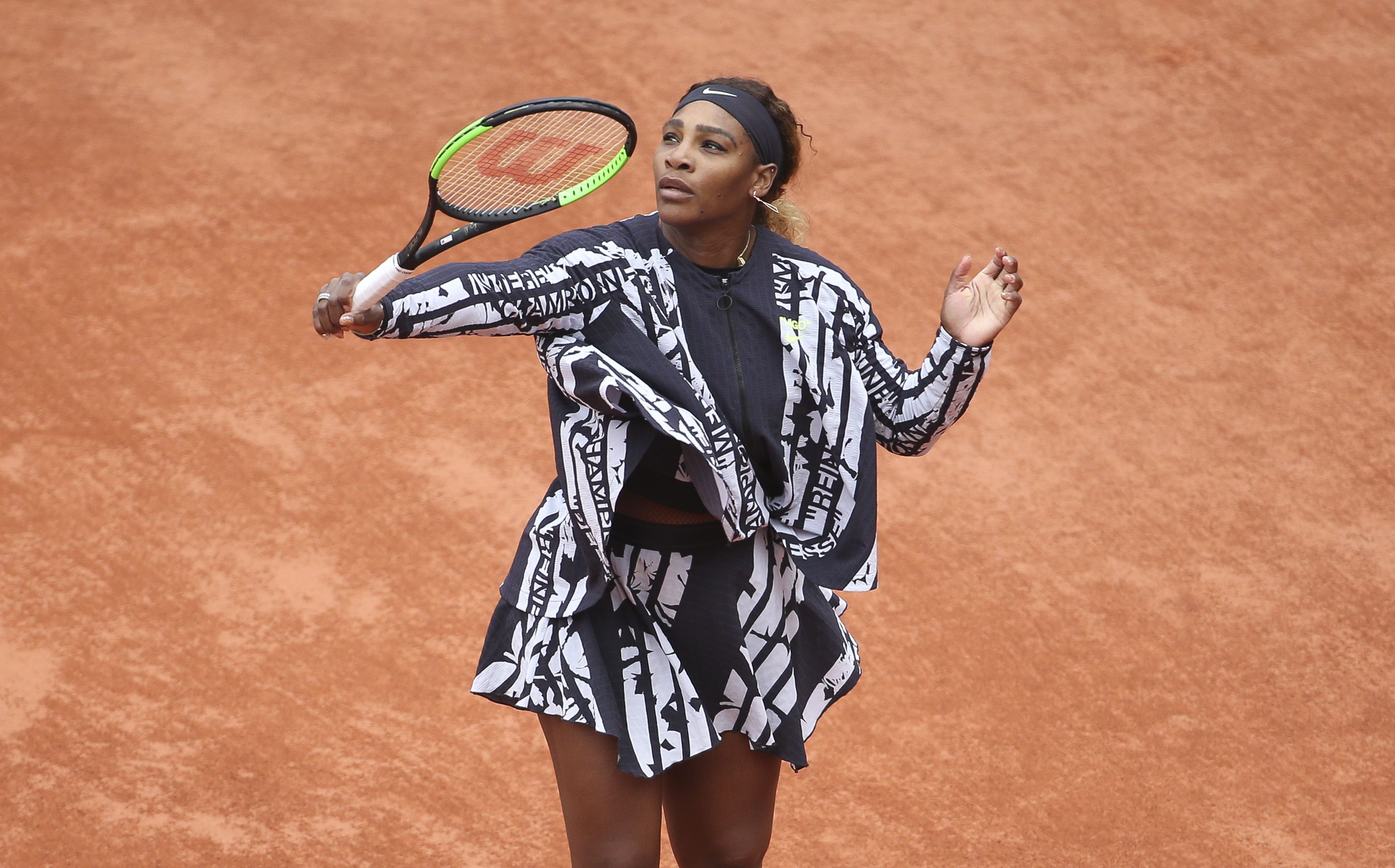 Serena Williams wearing a Virgil Abloh design where the dress was inscribed with the French words for mother, champion, queen and goddess.