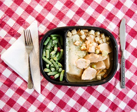 USA, New Jersey, Jersey City, close up of TV dinner on checked table cloth