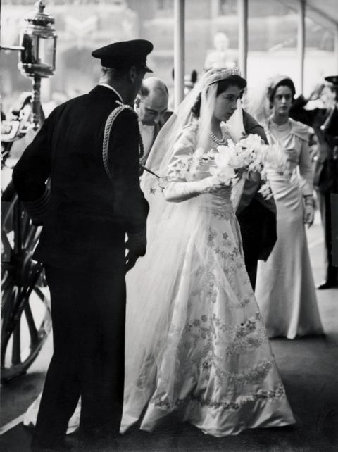 Princess Elizabeth arrives at Westminster Abbey with her father on her wedding day. princess elizabeth arrives at westminster abbey
with her father on her wedding day