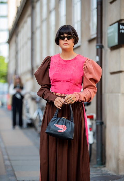 copenhagen, denmark   august 07 maria bernad is seen wearing three tone pink brown pleated dress, black bag outside helmstedt during copenhagen fashion week springsummer 2020 on august 07, 2019 in copenhagen, denmark photo by christian vieriggetty images