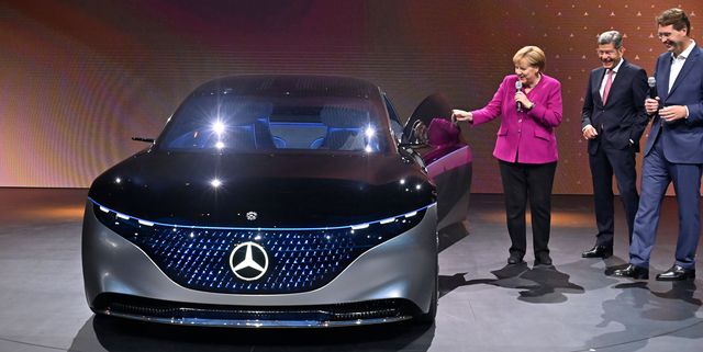 german chancellor angela merkel shares a smile with the ceo of german car maker daimler ola kaellenius r and bernhard mattes c, president of the german association of the automotive industry vda, next to a mercedes vision eqs car at the booth of daimler as she tours the fair grounds after officially opening the international auto show iaa in frankfurt am main, western germany, on september 12, 2019   frankfurts biennial international auto show iaa opens its doors to the public, but major foreign carmakers are staying away while climate demonstrators march outside    forming a microcosm of the under pressure industrys woes photo by tobias schwarz  afp        photo credit should read tobias schwarzafp via getty images