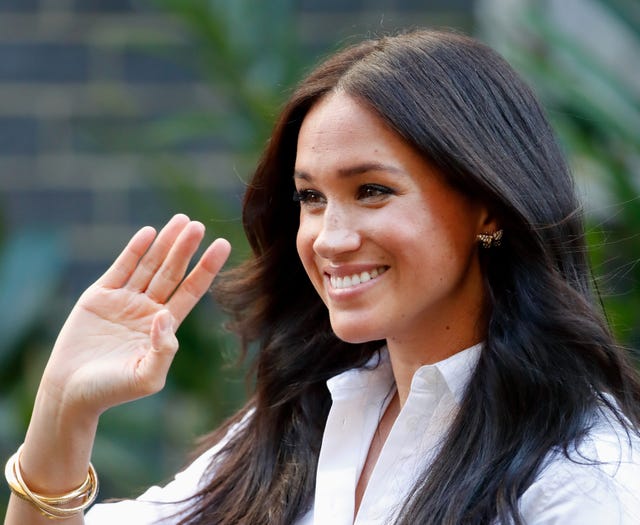 Meghan Markle Smiles In Never-Before-Seen Picture At A Soup Kitchen Ahead Of Christmas 