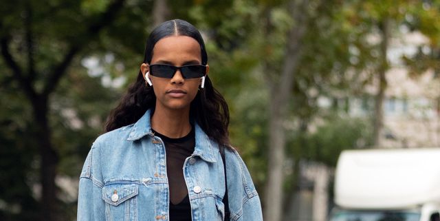 paris, france   september 26  model natalia montero wears airpods, a denim outfit   denim jacket, denim pants, and black boots after the ann demeulemeester show during paris fashion week springsummer 2020 on september 26, 2019 in paris, france photo by melodie jenggetty images