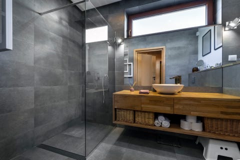 modern interior design   bathroom in gray and wooden finishing